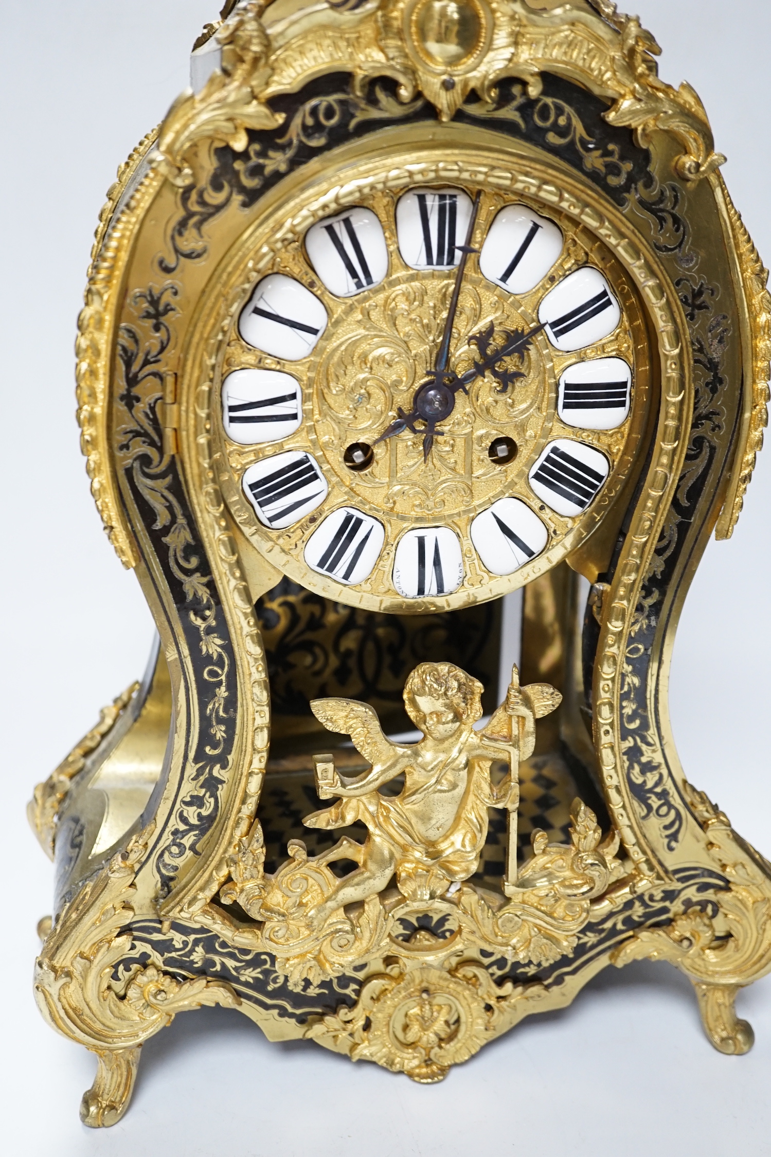 A large Louis XV style cut brass inlaid mantel clock, with a two train, French movement, striking on a bell, 50cm high